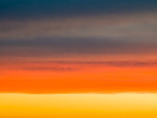Abstract in sky from multicolored clouds at sunset