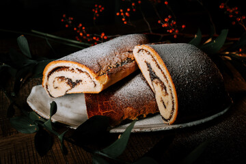Delicious Poppy Roll With Strudel and Beverages on a Festive New Year's Table