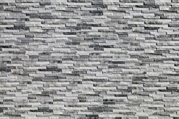 Stoneware panel wall with stone effect. Colors are gray, white and black. Long horizontal strips....