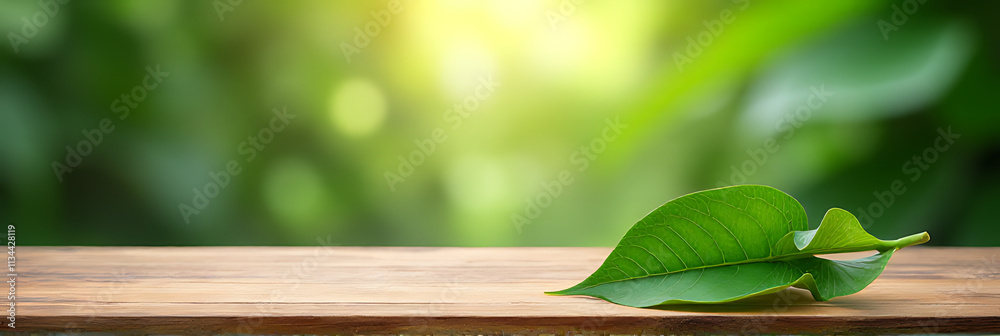 Poster a beautiful tropical background features a wooden table top empty except for a lush green leaf from 
