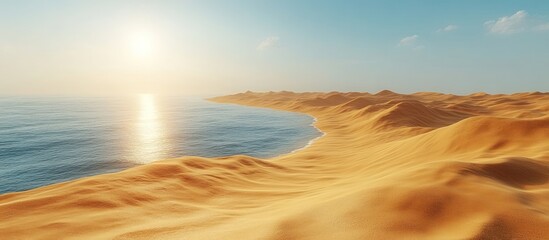 Desert meets ocean at sunset; golden sand dunes and blue water.