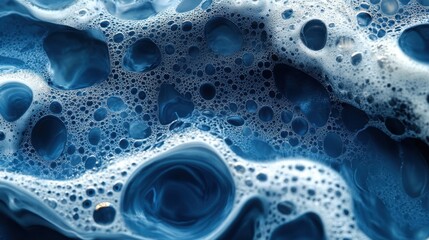 Mesmerizing blue bubbles create an abstract underwater world filled with texture and depth at a close glance