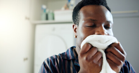 Laundry, black man and smell in home for clean blanket, fresh scent and linen fragrance for happy...