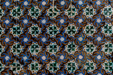 Traditional tiled wall decoration in a city palace in Seville, Spain.