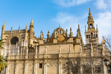 Seville cathedral Giralda tower of Sevilla Andalusia Spain Church on sunny day.