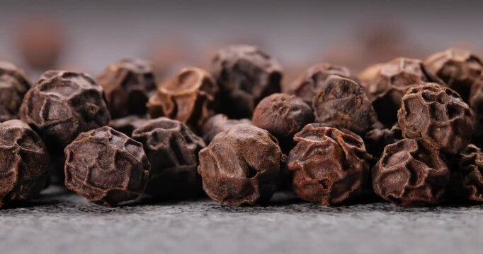 Peppercorns or black pepper spice. Super Macro Close Up.