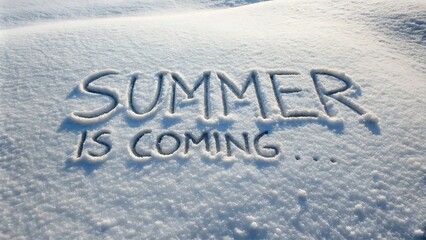 Snow message: summer is coming written in fresh white snow