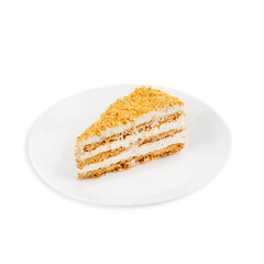 A piece of honey cake on a plate, on a white background, isolated.