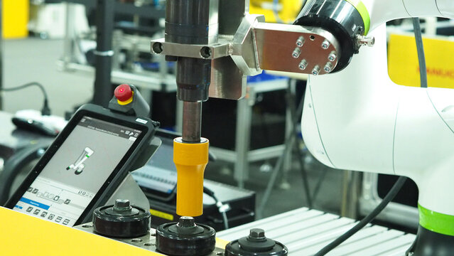 High torque tightening machine with robot arm.