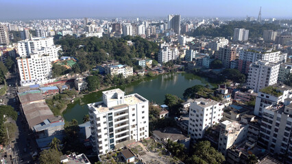 Obraz premium Buildings are being constructed by filling ponds in the cities of Bangladesh. It is endangering the environment. Skyline or Cityscape of Chittagong City,Bangladesh. Taken form asker dighi par,Middle C