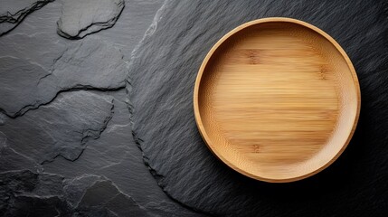 A natural bamboo plate on a slate surface, exuding a raw and eco-friendly aesthetic