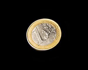 One euro coin, face of one euro coin isolated on black