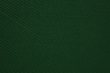 A sheet of dark green corrugated leather texture as background