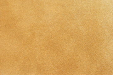 Golden smooth dust glitter texture as background