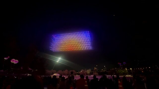 Seoul, South Korea - November 30, 2024 The final scene of the drone light show at night Drones with multi-colored lights, straight as taut threads, row by row return to base