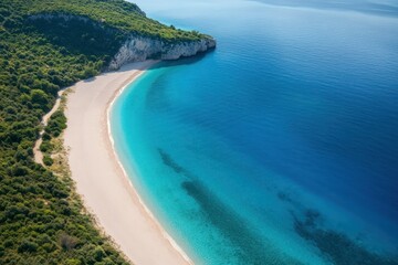Obraz premium Aerial View of Serene Tropical Beach with Crystal Clear Water and Lush Green Surroundings in a Peaceful Coastal Paradise