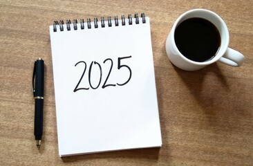 Notebook on spring with numbers 2025 on first blank page, top view. New phase, New Year list of resolutions, to-do list