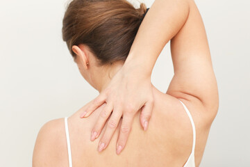 Back pain background. Relief for neck with massage. Rehabilitation and care for better health. Muscle tension rehabilitation. Physical therapy techniques. Muscle pain medicine. Woman isolated on white