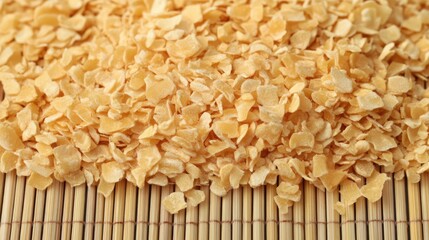 Dried Yellow Corn Kernels on Natural Bamboo Background for Cooking
