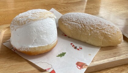 Cream Filled Pastry and Powdered Bun on Festive Tray on Wood Table