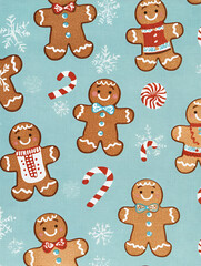 Obraz premium A festive pattern featuring gingerbread cookies and candy canes on a light blue background.
