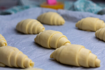 Classic French pastry. Raw croissants before baking, close-up.