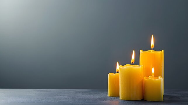 Calm and Serene Yellow Candles with Flames on a Dark Background