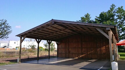 Wooden carport, ideal for vehicle storage or outdoor shelter solutions.