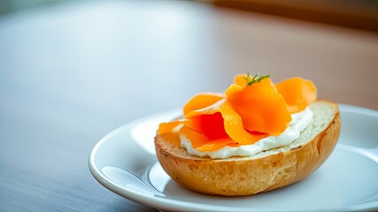 A delectable bagel topped with creamy cheese and savory smoked salmon, garnished with fresh herbs.