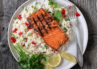 grilled red salmon fillet with rice, top view