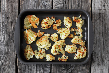 oven baked cauliflower florets in a baking tray