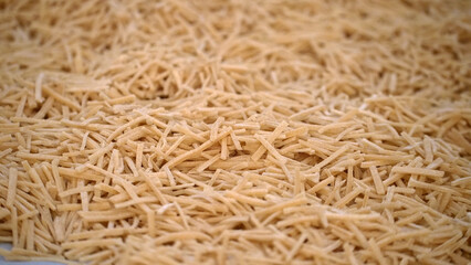 Cutting noodles from homemade natural wheat flour dough,