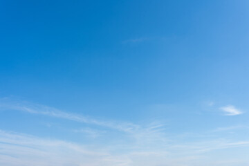 Clear Blue Sky with Delicate Clouds Nature Background Image
