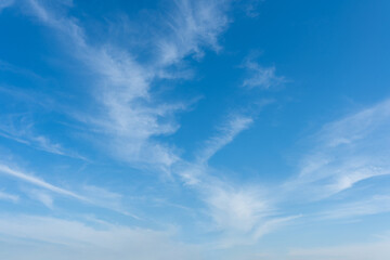 Serene Blue Sky with Wispy Clouds Nature Background