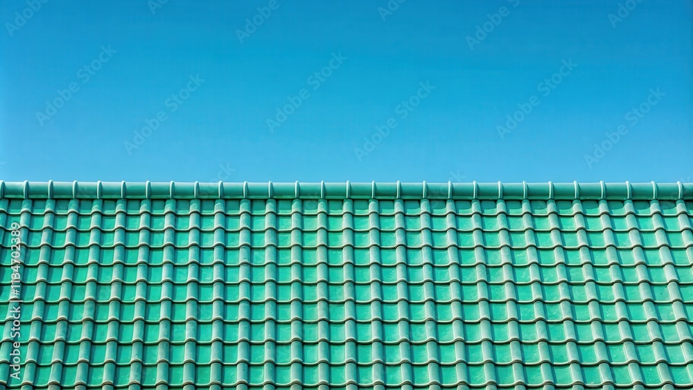 Poster a symmetrical roof with a patterned design of green tiles against a blue sky.