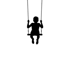 Silhouette of a child on a swing set.