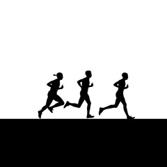 Fototapeta premium Silhouettes of three runners competing in a race