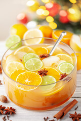 Homemade hot alcohol apple cider punch with cinnamon sticks, anise star and spices