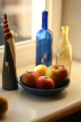 
festive winter still life with bottles and apples