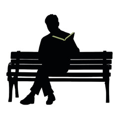 Silhouette of a man sitting on a bench and reading a book.