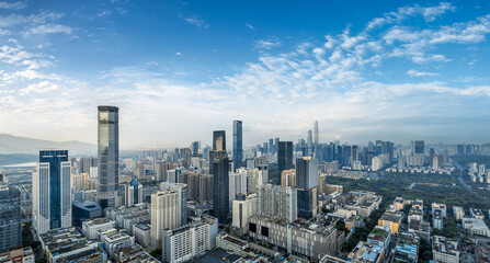 Modern city skyline and natural scenery at sunrise in Shenzhen, China