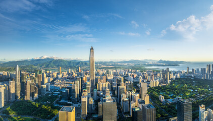 Modern city skyline and natural scenery at sunrise in Shenzhen, China