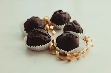 Tasty chocolate bonbon sweets on table