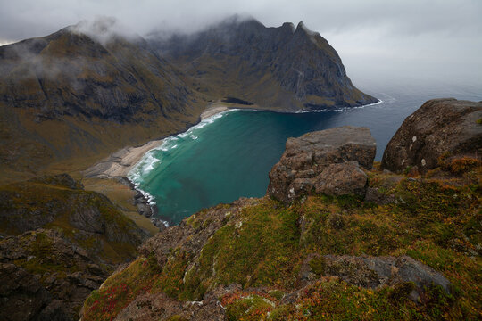Autumn colours at Kvalvika Beach on the Lofoten Islands from above. The summit lookout of  Ryten in Norway.