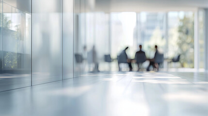 Office or meeting room with business people meeting in a blurred background. Copy space.