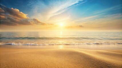 Obraz premium Golden Sand Beach at Sunset with Gentle Waves and a Sky Painted with Warm Hues