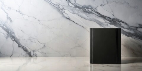 A Black Book Resting on a Sleek Marble Surface, Ready for a Story to Unfold