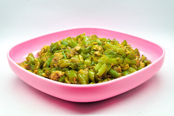 Stir-fried green beans mixed with chicken eggs served on a plate. isolated on white background