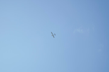Airplane flying in the blue sky, unfocused background