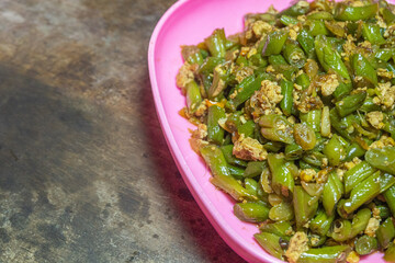 Stir-fried green beans mixed with chicken eggs served on a plate